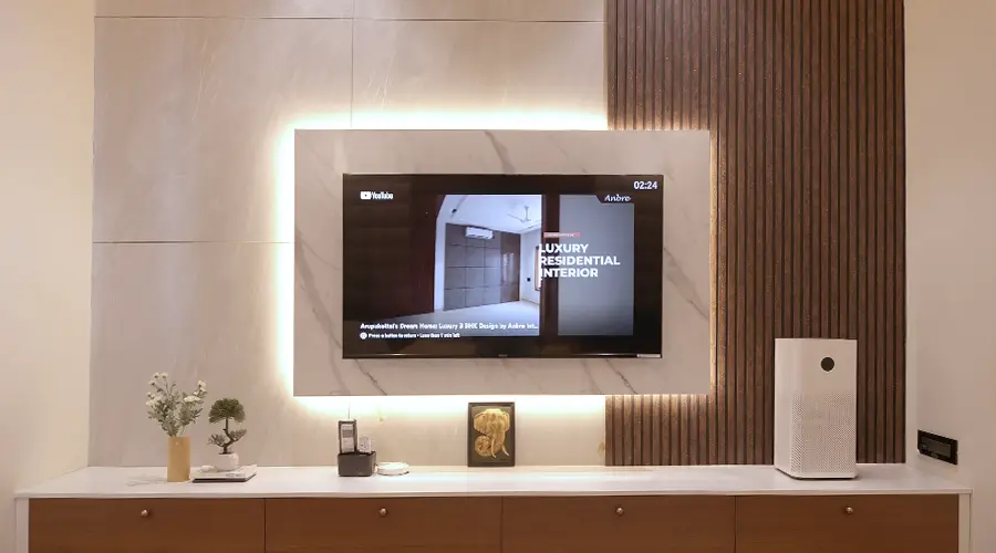 Neat and simple TV unit with wooden rafter and marble finish panel